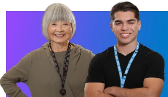 Two smiling Ross Associates wearing lanyards