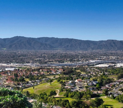 A city with a mountain in the background