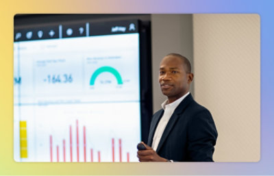 A man explaining on the board showing some graphs 