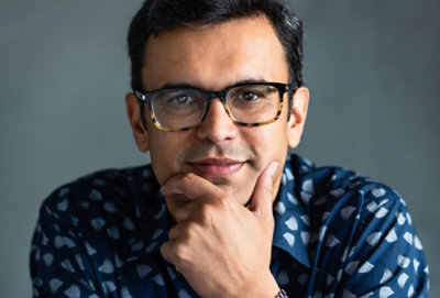 A man with his hand on his chin.