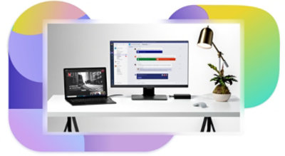 A desk setup with a laptop and monitor displaying a presentation being given over a Teams video call and a text chat in Teams.