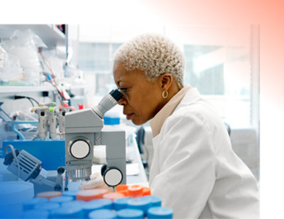 A person looking through a microscope