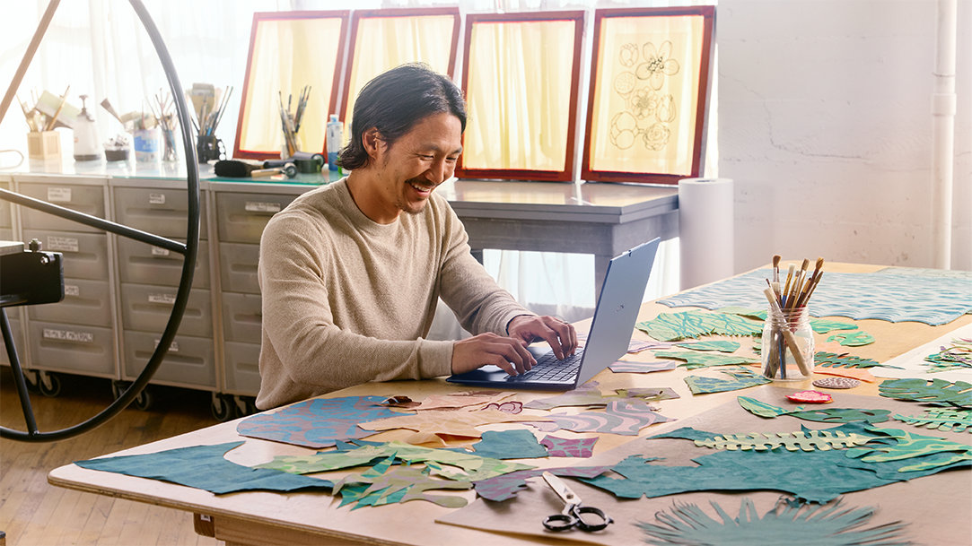 A creative man inside working on laptop