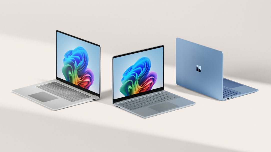 An image of three Surface Laptop, Copilot+ PCs on a white table