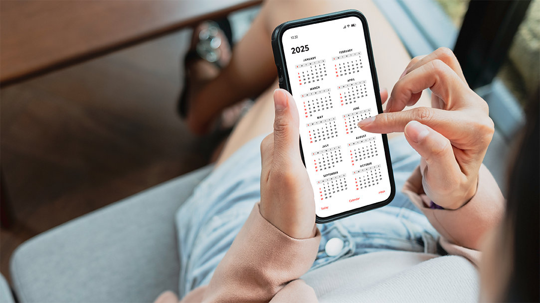 Woman using her cellphone calendar