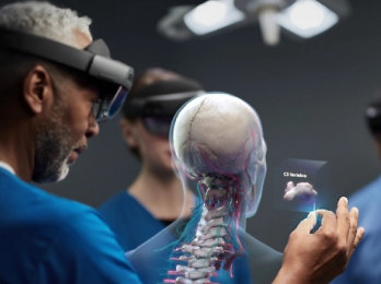 Two people looking at a skeleton