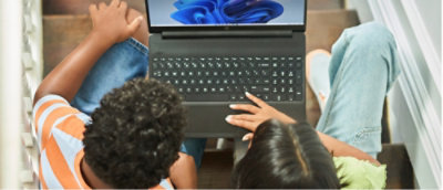 A group of people looking at a computer