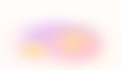 Imagen borrosa en la que se mezclan colores pastel como el morado, el naranja y el rosa sobre fondo blanco.